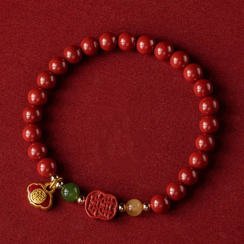 Emperor sandstone Happy Eyebrow Bracelet with cinnabar detail and fu character in New Chinese style.