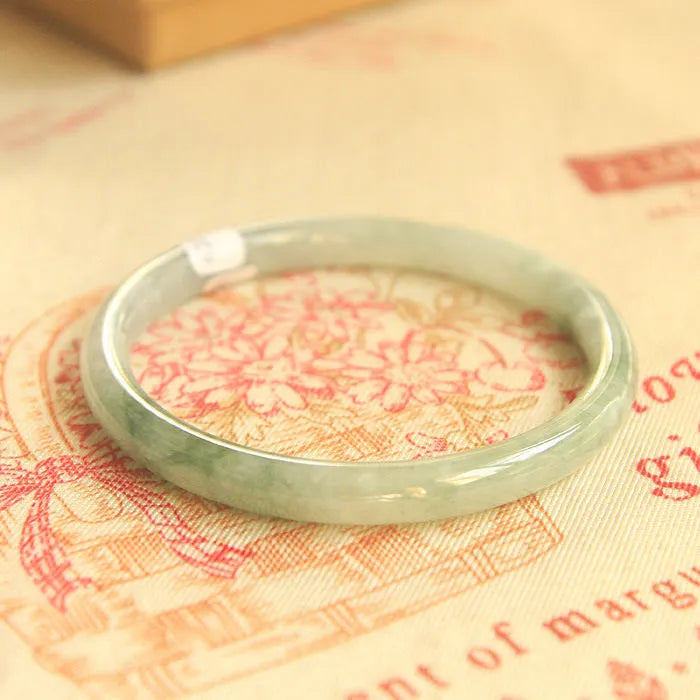 Green jade student bracelet with geometric beads showing Chinese style design and adjustable sizing options