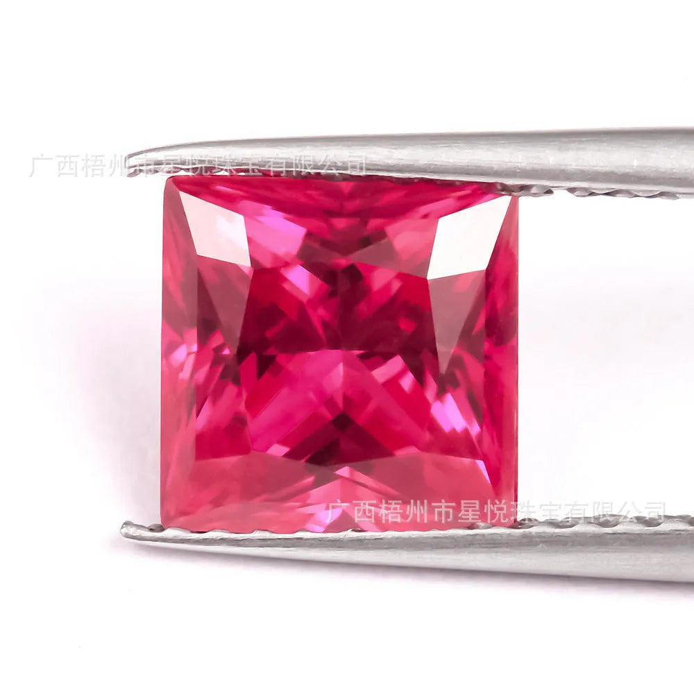 Cultivated ruby gemstone in princess, round, water drop, and egg shape cuts on a white background.