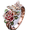 Adjustable fairy style butterfly alloy ring with colourful oil drip finish and floral insect leaf design.