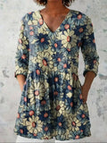 Women's retro style slim fit long-sleeved top with a printed design, shown on a hanger.