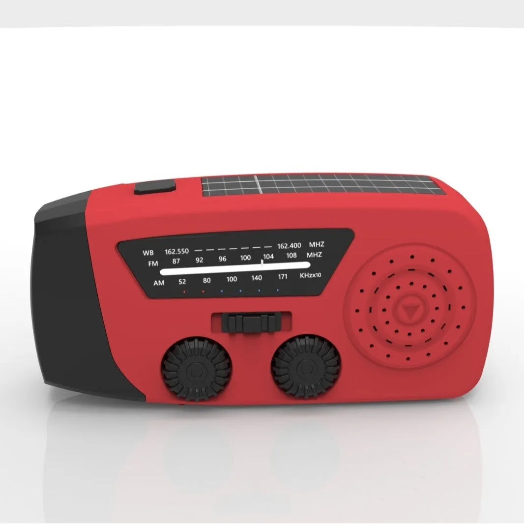 Red rechargeable emergency hand radio with torch, hand crank, and wrist strap on a white background.