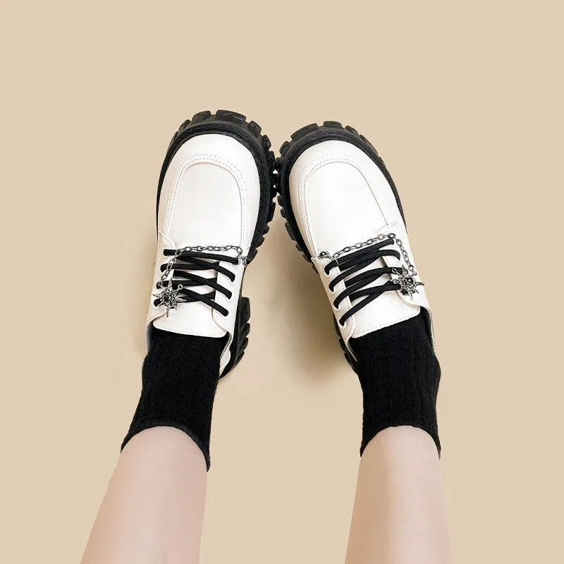 Women's preppy jk style loafers in Duke Asterism colour with metal cross shoulder straps and round toe