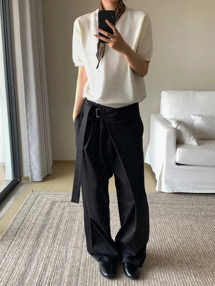Black straight-leg women's trousers with a front pleat and adjustable waistband on a hanger.