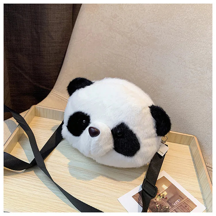 Soft plush crossbody bag with panda head design, cylindrical shape, and an outer sandwich pocket.