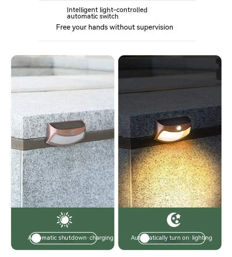 Solar-powered retro decorative wall lamp with smiling face design for garden lighting
