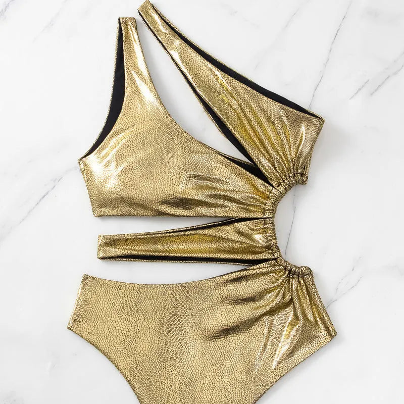 Gold backless one-piece women's swimsuit on hanger showing solid colour and sleeveless design