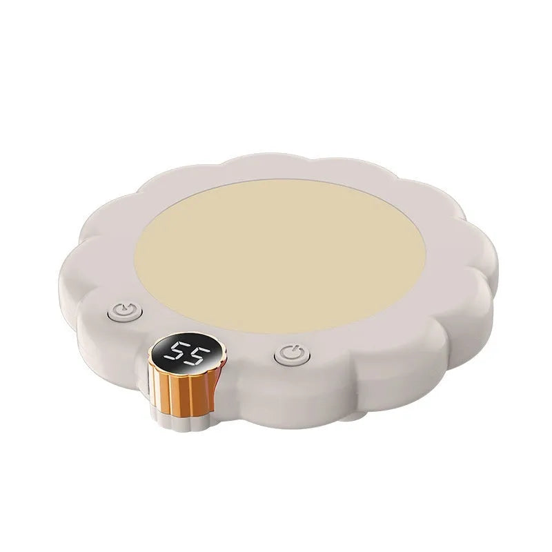 Plug-in thermal cup pad in white or pink with 20W rated power, three gears, and push-button control on a desk.