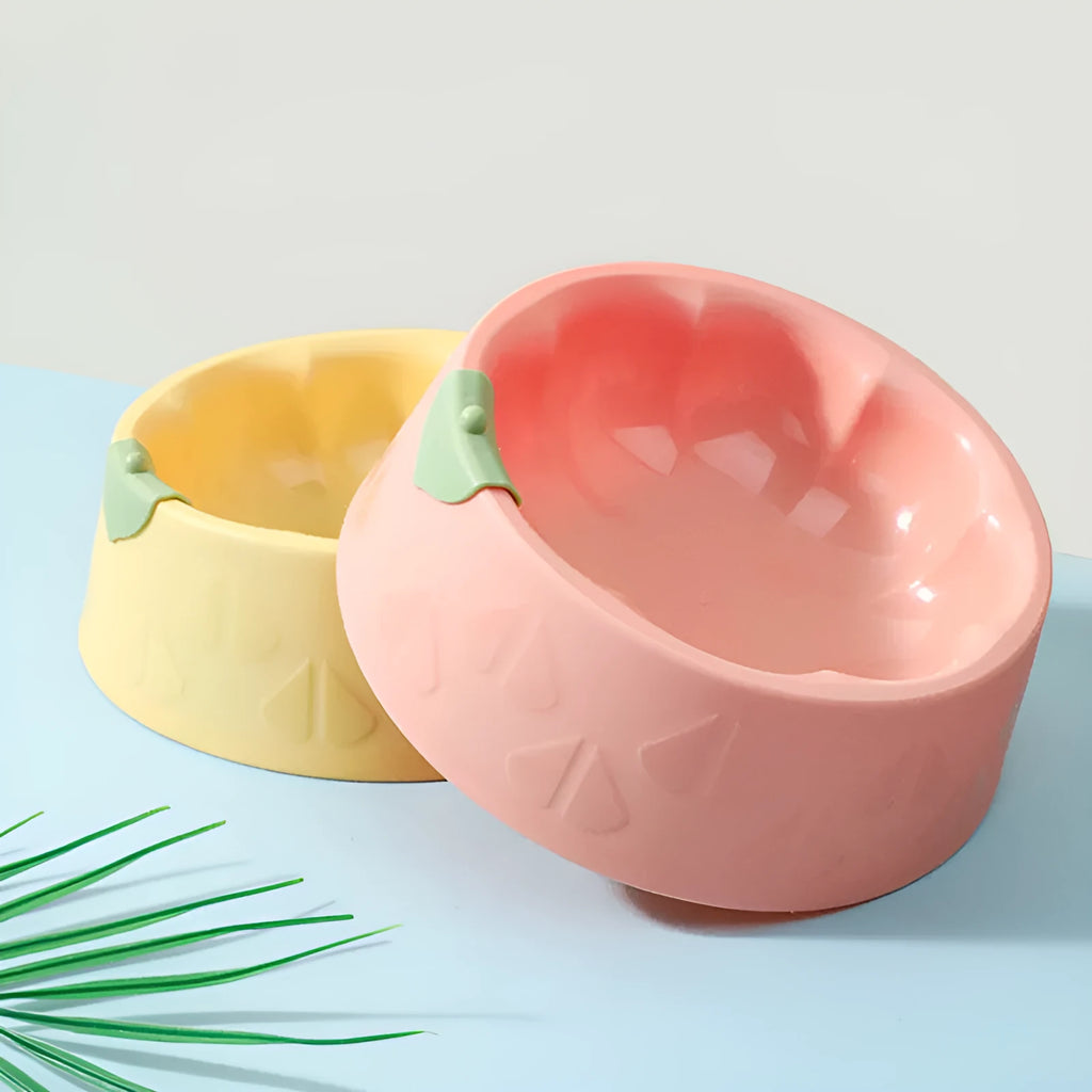 Green flower-shaped plastic pet bowl for cat or small dog food and water.
