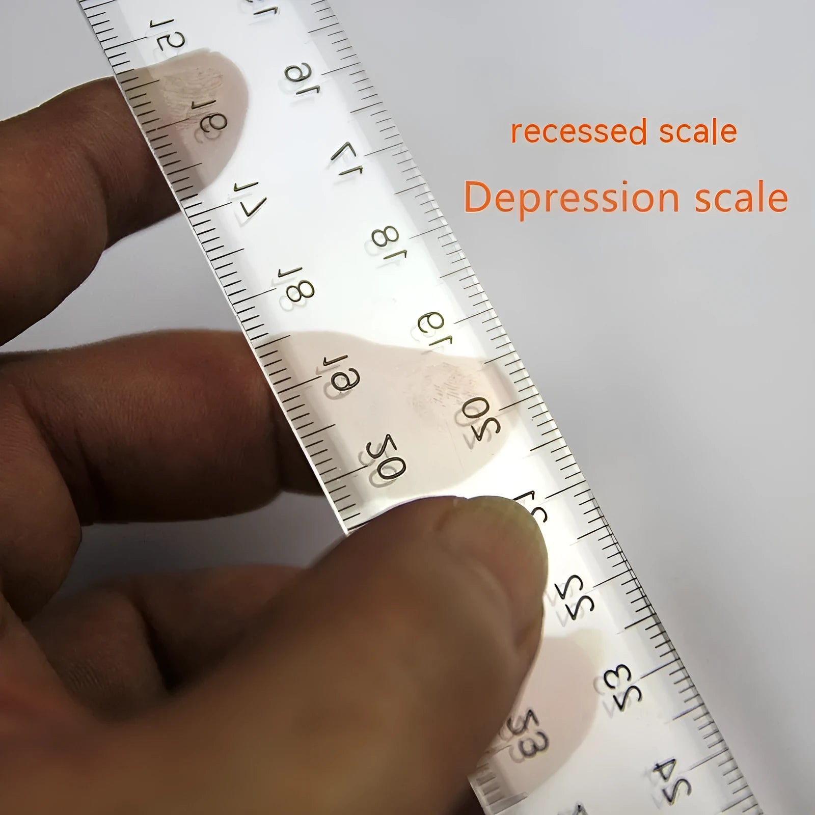 Transparent T-shaped plastic ruler with measurement scales for technical drawing