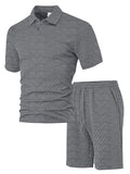 Men's patterned cloth casual short sleeve suit set with polo shirt and trousers on a hanger