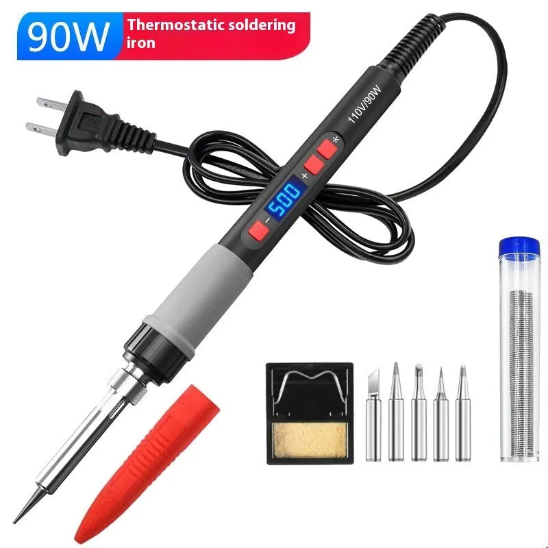 Grey 90W electric soldering iron with ceramic heating core, five tips, sponge, and tin wire on a workbench.