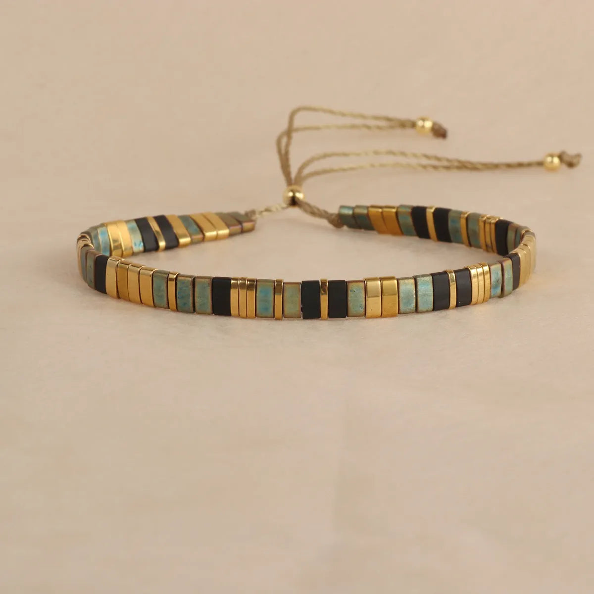 Geometric glass bead bracelet with pull design in milky white colour
