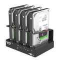 External four-bay hard drive expansion dock for 2.5 inch SATA drives with cables and brackets.