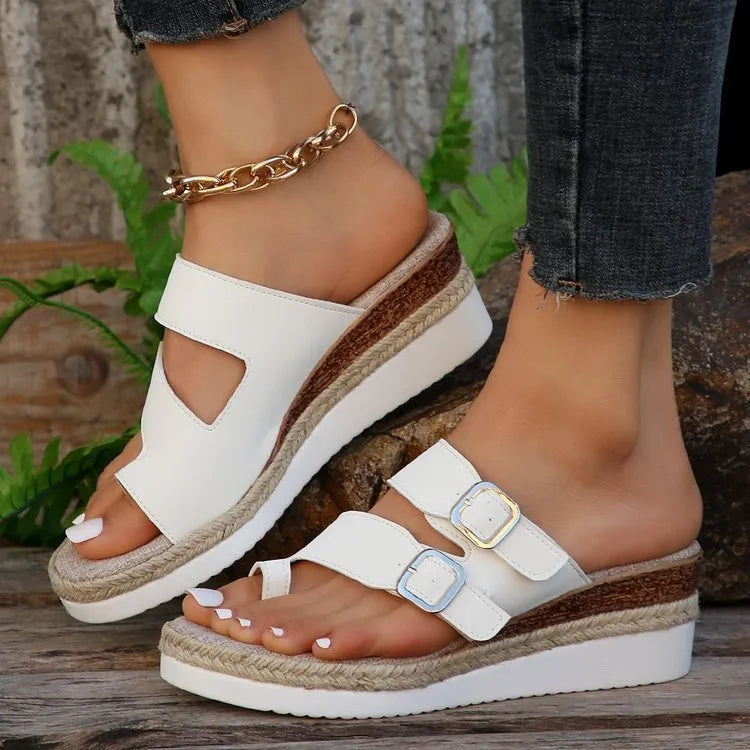 White patent leather wedge sandals with woven peep toe and finger fit design