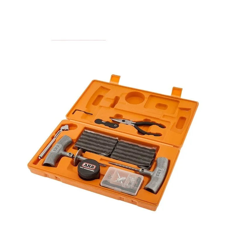 Emergency tyre repair tool set with pressure gauge, insertion tool, and reamer in a yellow case.