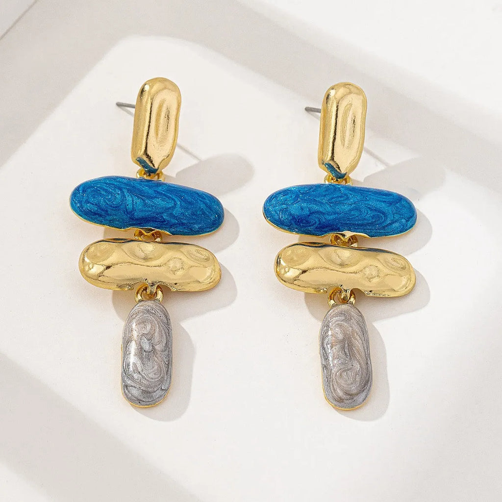 A pair of geometric stud earrings with a multicolour electroplated finish on a zinc alloy base.
