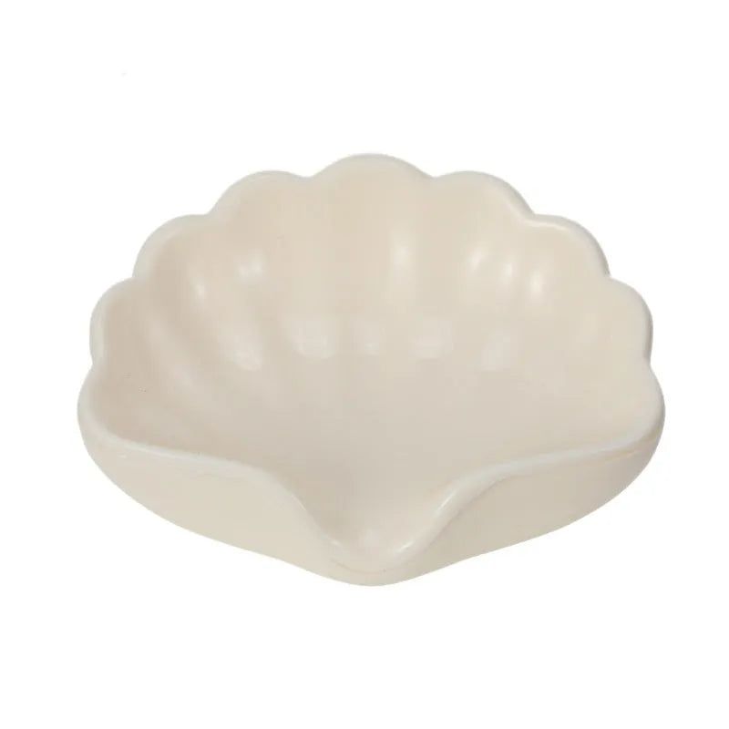 Plastic shell-shaped soap dish in pearl white or pink for bathroom use