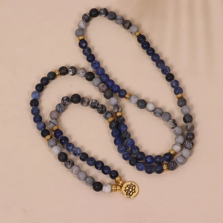 Blue patterned network stone beads on a multi-layer alloy bracelet in a natural style.