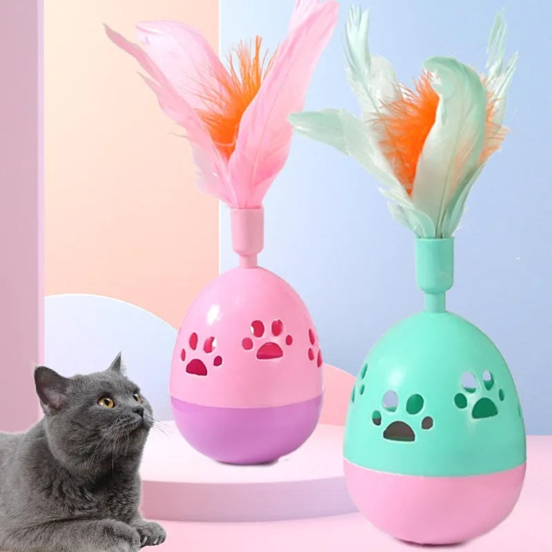 Tumbler bell cat toy in pink purple green, 15cm ABS plastic body with feathers and 6.5cm base