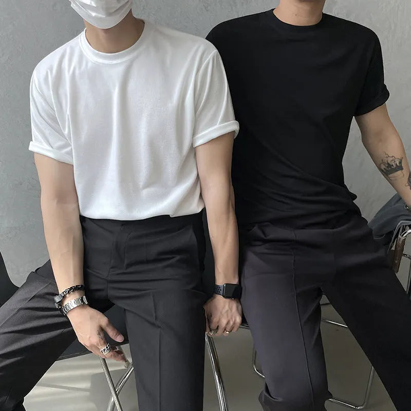 Men's solid black and white round neck cotton t-shirt with half sleeves and slim fit design.