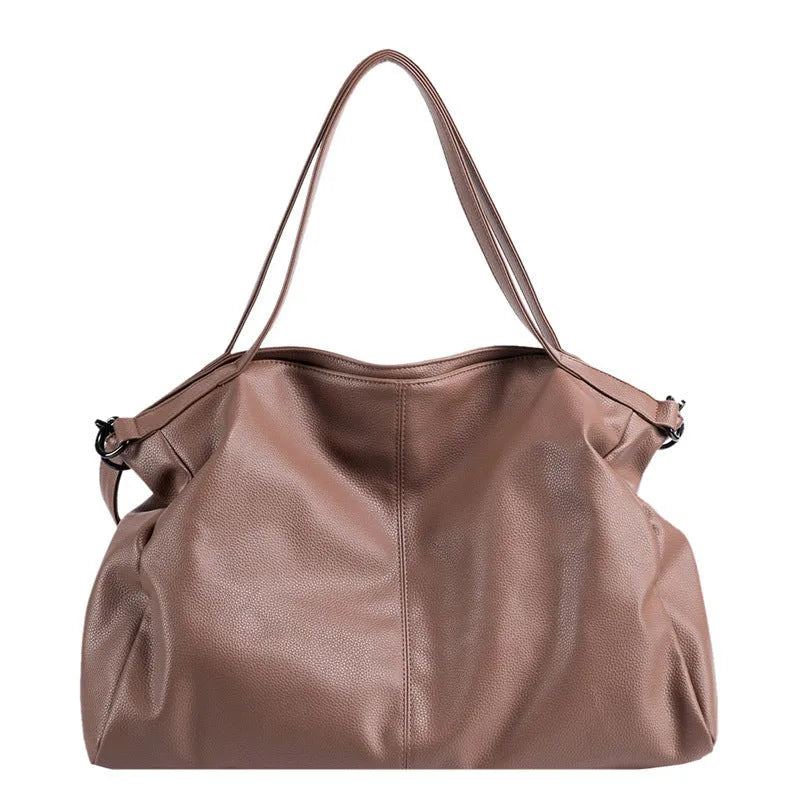 Large soft PU messenger bag in khaki colour with a long shoulder strap, shown open to reveal inner phone pocket.