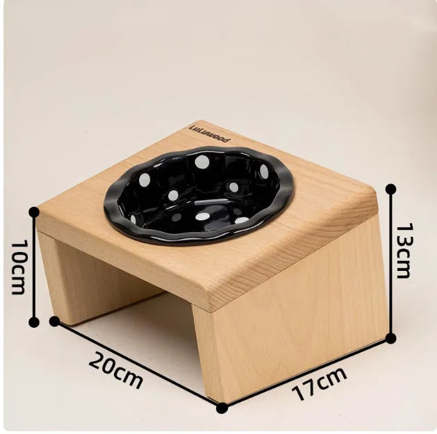 Beech heightened pet bowl rack with one ceramic polka dot bowl in beige, black, or colour option, shown as a raised feeding stand