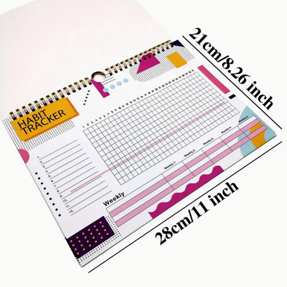Habit tracking journal notebook open showing planning pages with colour options