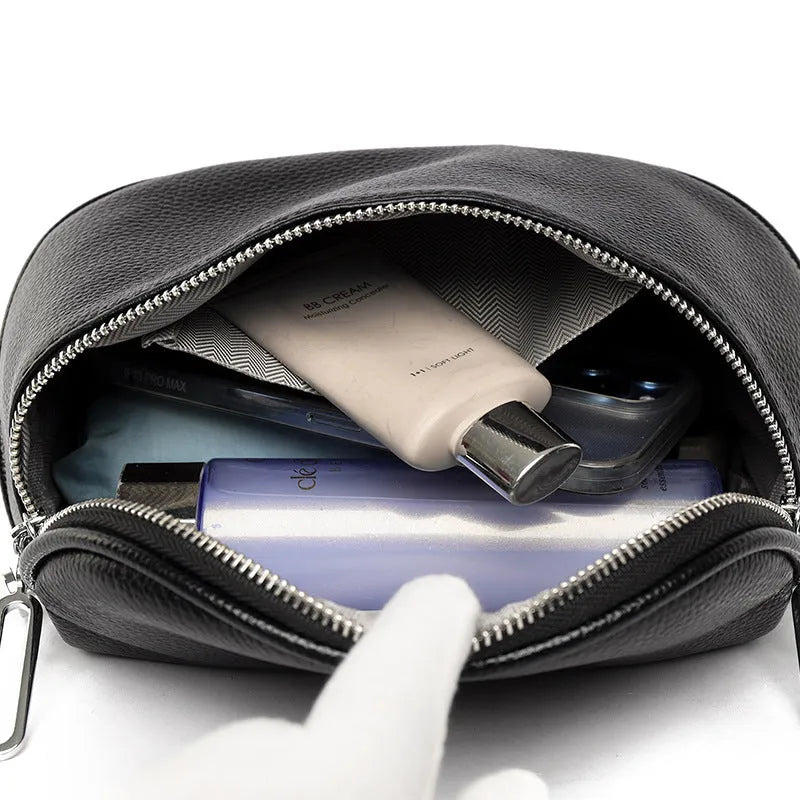 Women's saddle-shaped PU leather messenger bag in black with crossbody strap