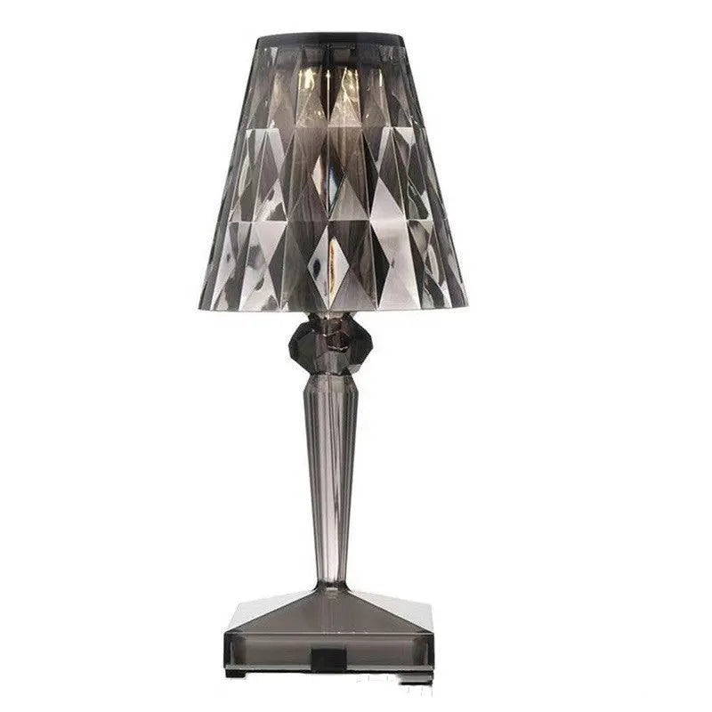 Rose gold portable touch control night light with acrylic lamp holder on a wooden surface.