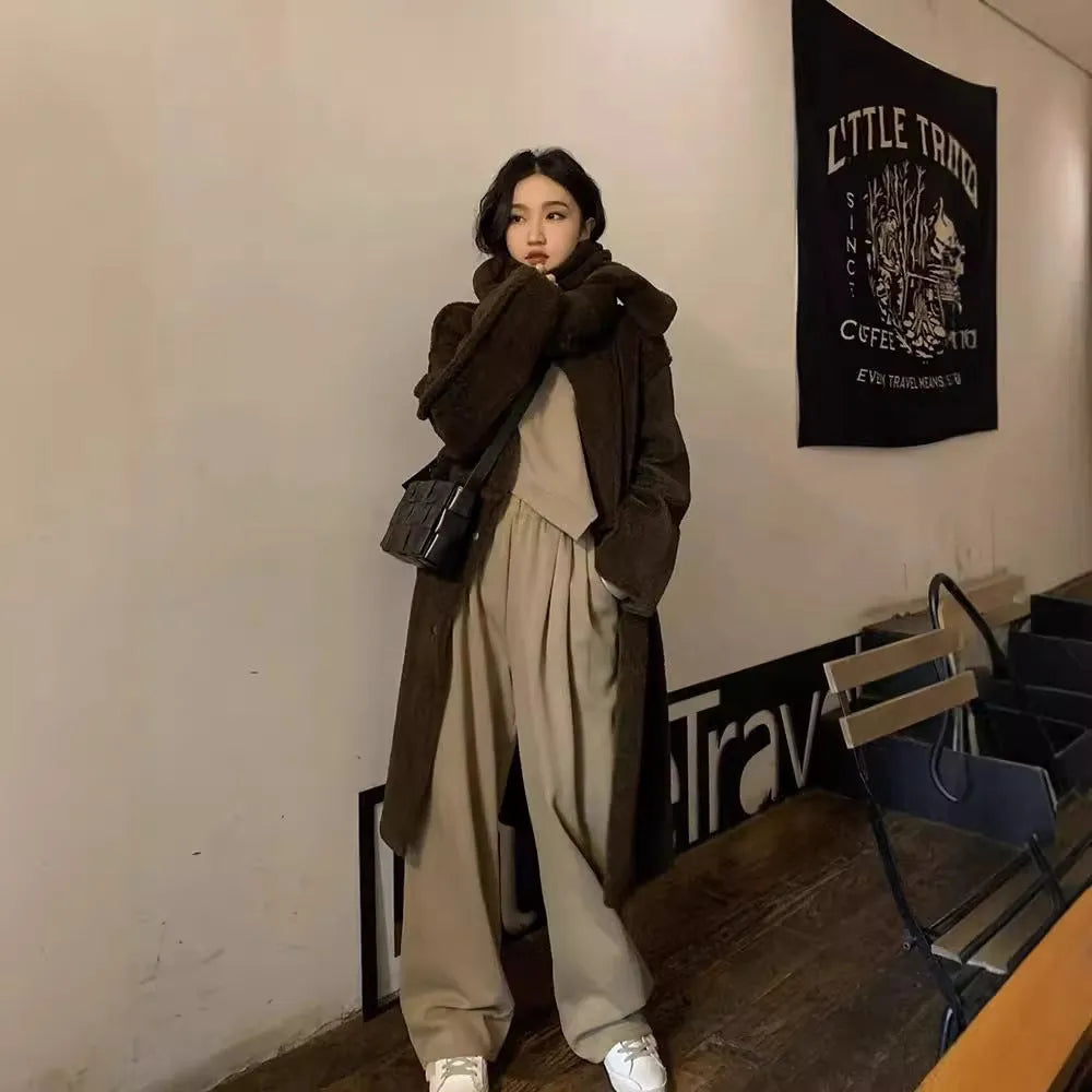 Women's casual sports suit set showing khaki coloured top and trousers with loose fit design