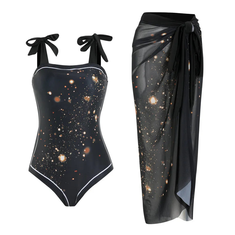 Floral print one-piece swimsuit with mesh tube top and detached skirt shown in brown.