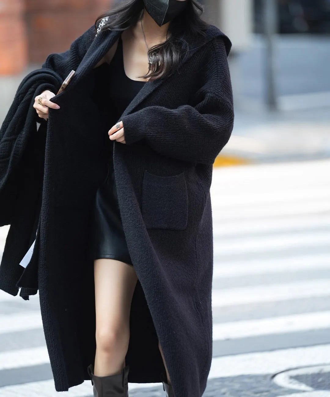 Long grey knitted hooded cardigan with trench coat styling on hanger