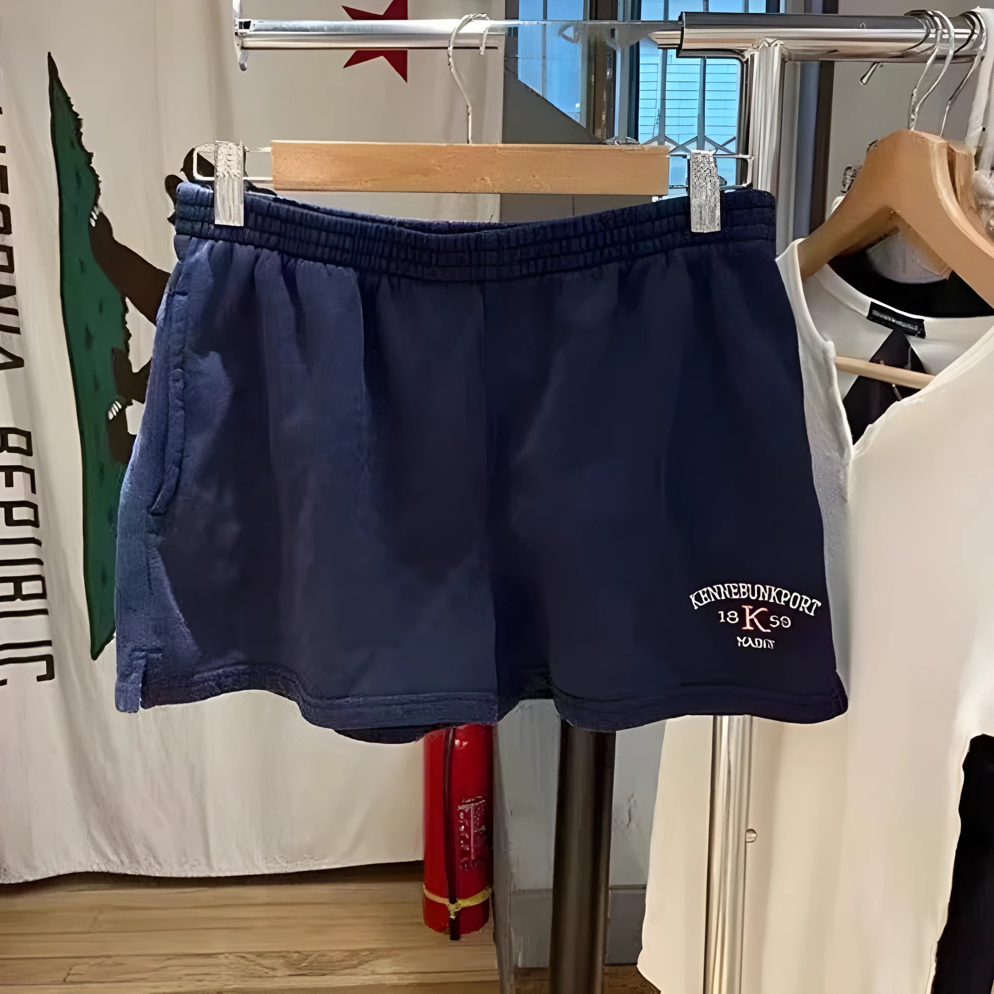 Women's dark blue cotton sports shorts with white flag embroidery and navy blue trim