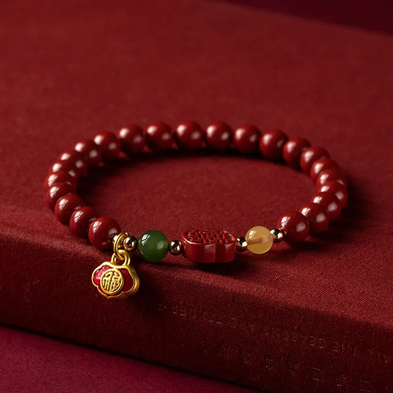 Emperor sandstone Happy Eyebrow Bracelet with cinnabar detail and fu character in New Chinese style.