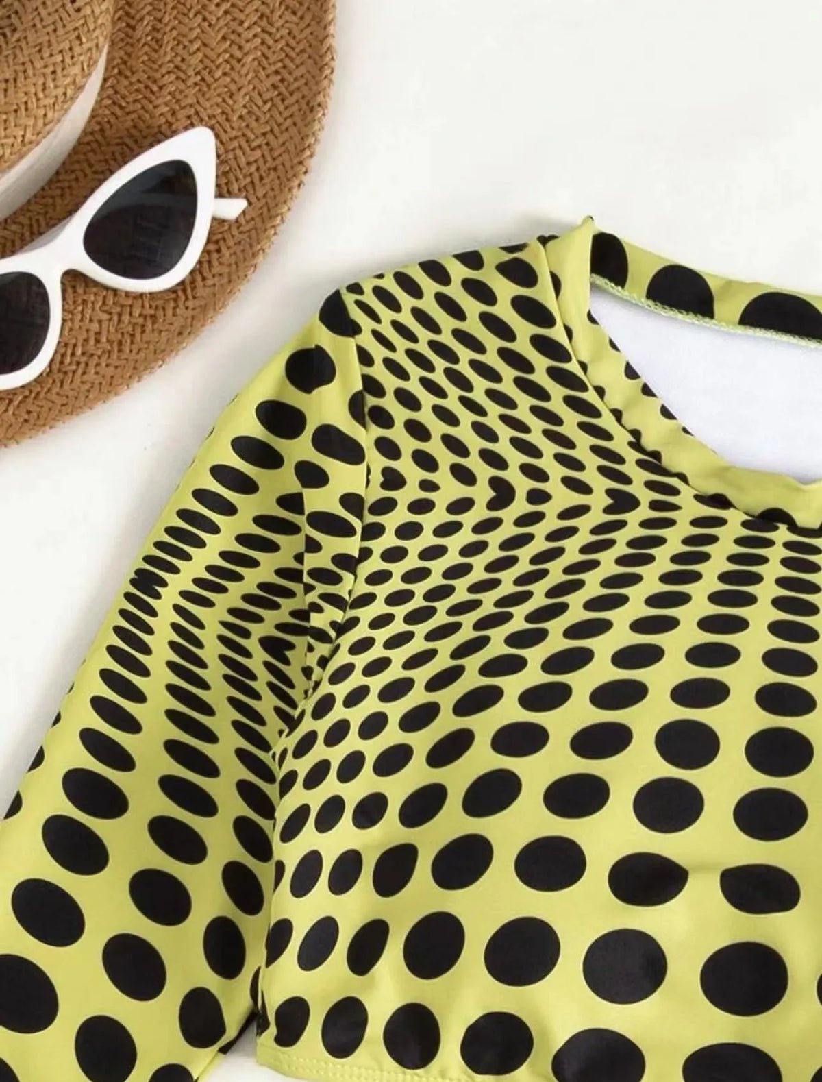 Green and yellow polka dot women's swimsuit three-piece set including top, skirt, and bra.