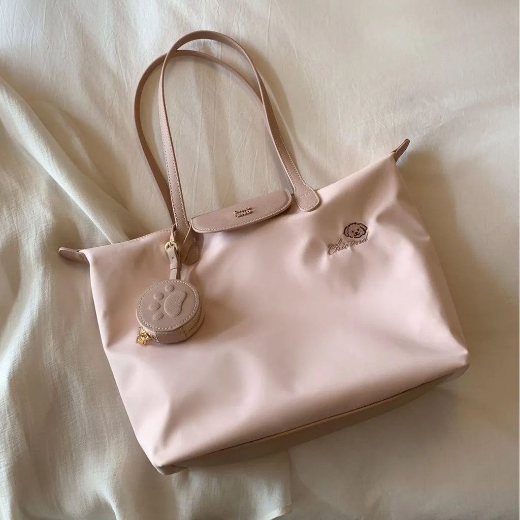 Oxford cloth tote shoulder bag in beige colour showing internal mobile phone pocket and sandwich pocket design