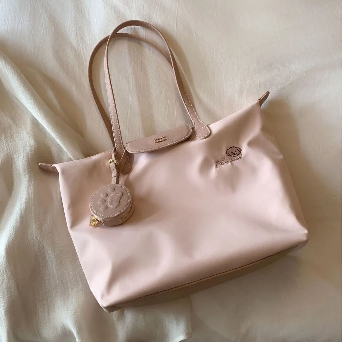 Oxford cloth tote shoulder bag in beige colour showing internal mobile phone pocket and sandwich pocket design