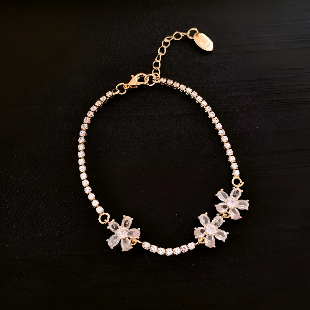 Gold tone geometric copper bracelet for women with zircon inlay detail.