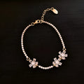 Gold tone geometric copper bracelet for women with zircon inlay detail.