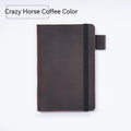 Handmade notebook with cowhide cover open on a table, showing 100 gsm wood-free paper inside
