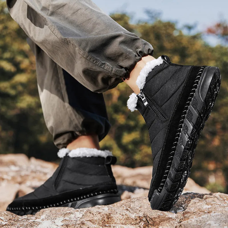 Men's green plus-size snow boot with round toe and flat heel on a rubber sole.