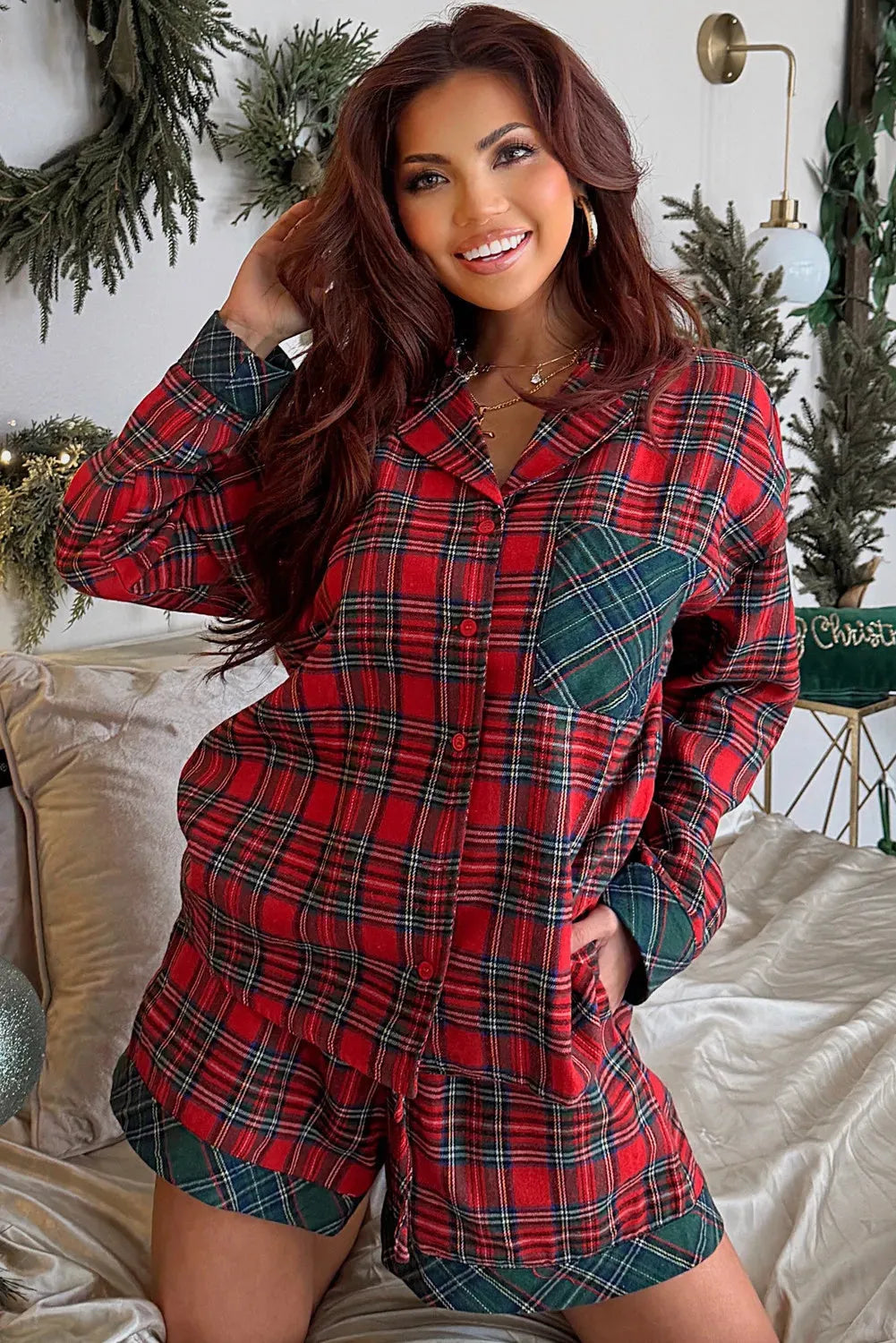 Red plaid Christmas pajama set with long sleeve shirt and shorts featuring contrast patches