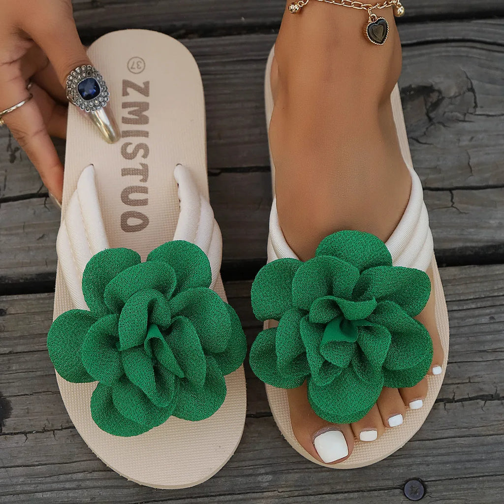 Plus size women's floral patterned PU flip flops in green, shown in a size 39.