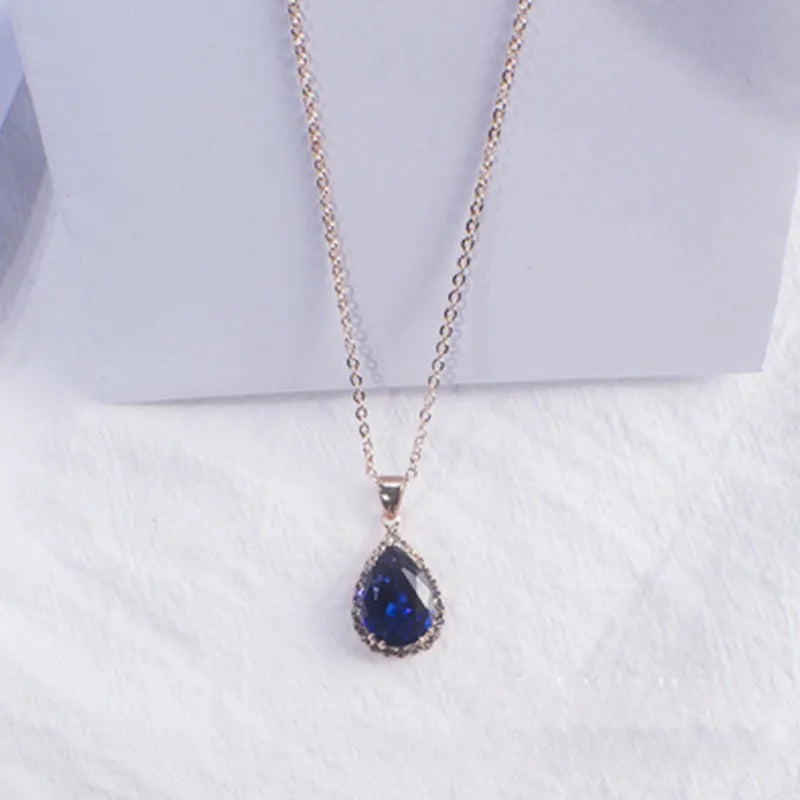 Rose gold water drop necklace with geometric rhinestone pattern in pink colour