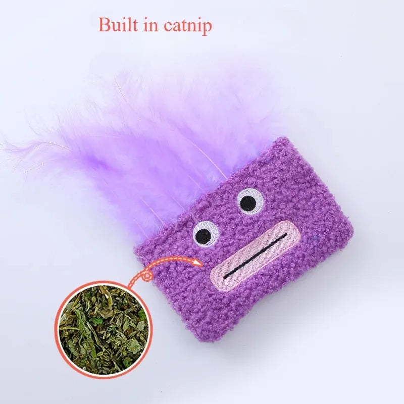 Colourful plush cat toy shaped like an explosion head with a big open mouth, shown in blue.
