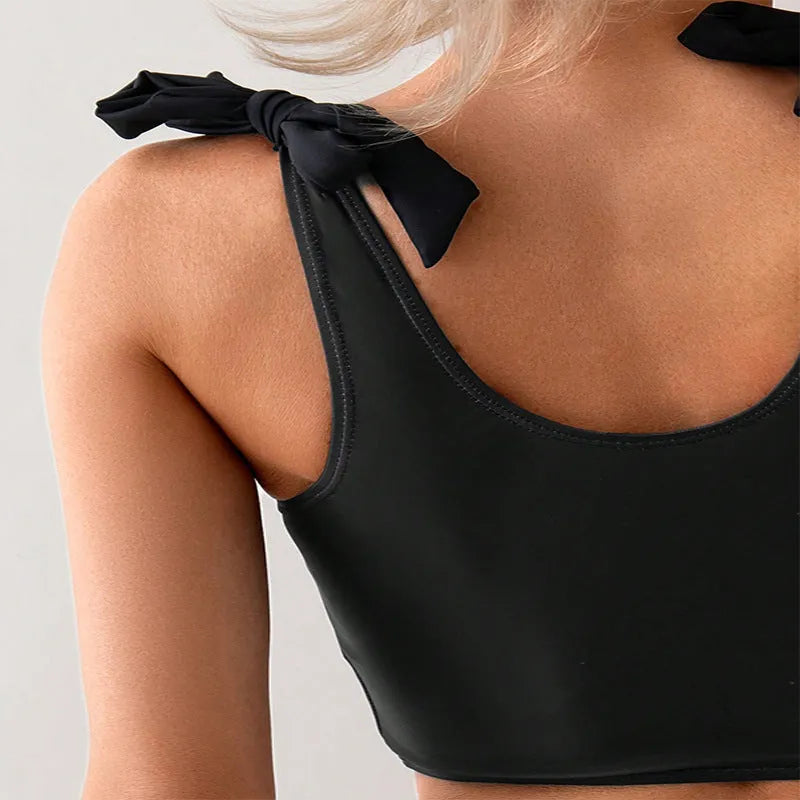 Women's coconut print bikini swimsuit with lace-up front detail on the top.