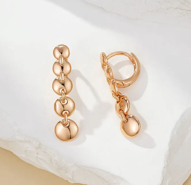 Gold-coloured retro long round circle earrings with woven texture on copper base