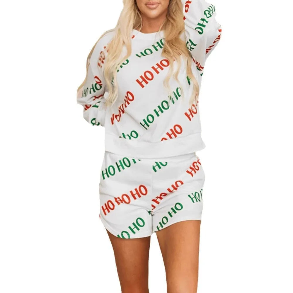 White women's two-piece suit with printed letters on the long-sleeved top and matching trousers.