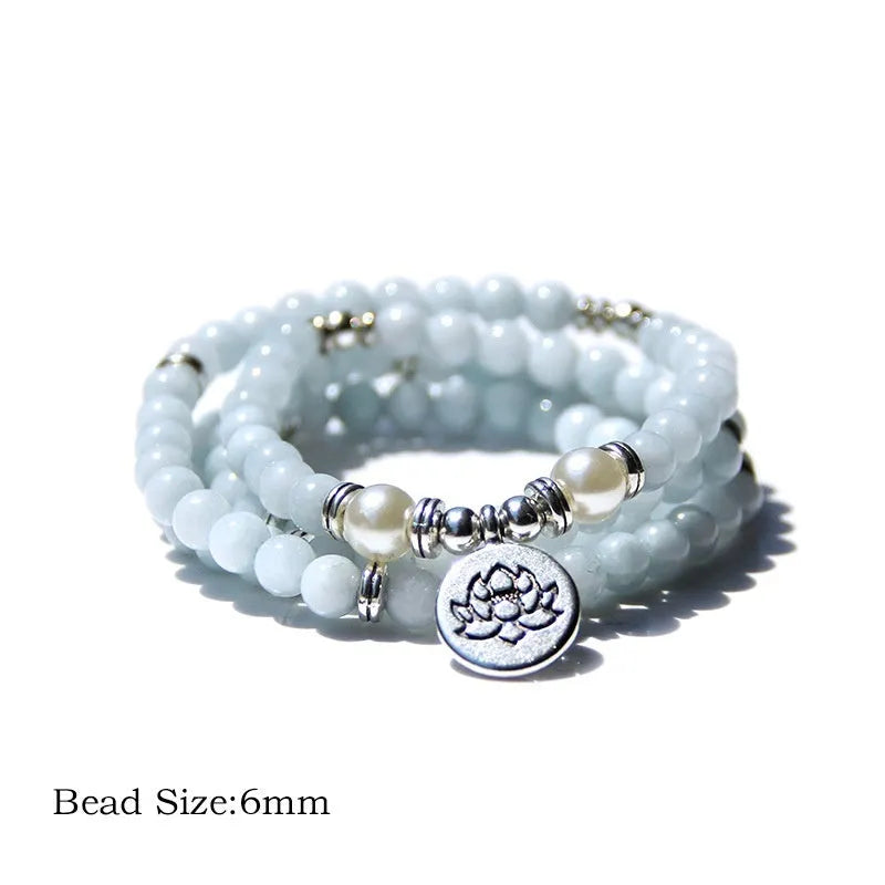 Natural stone ladies bracelet with geometric angel echeveria and lotus design on a wrist.